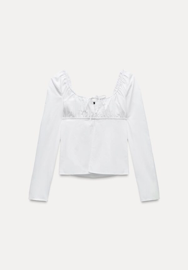 Blusa blanca lazos manga larga